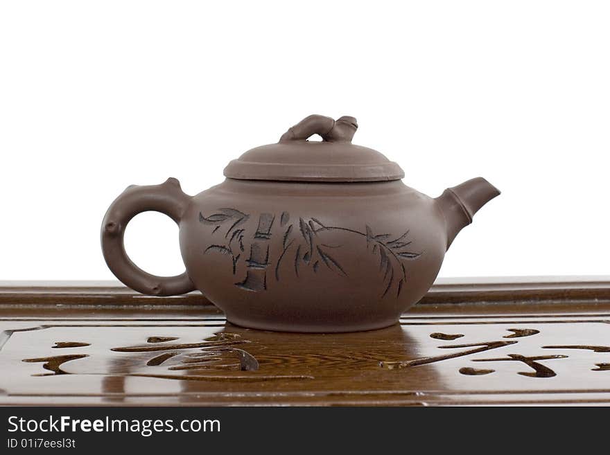 A teapot on a board