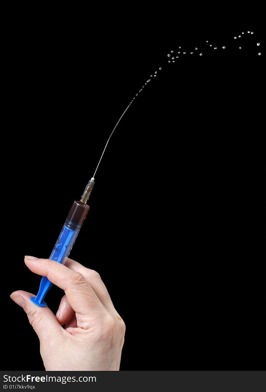 Syringe In A Hand