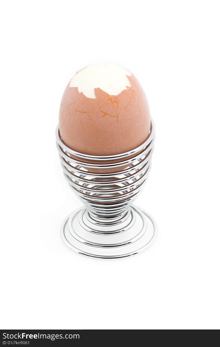 An Eggcup With A Pealed Egg