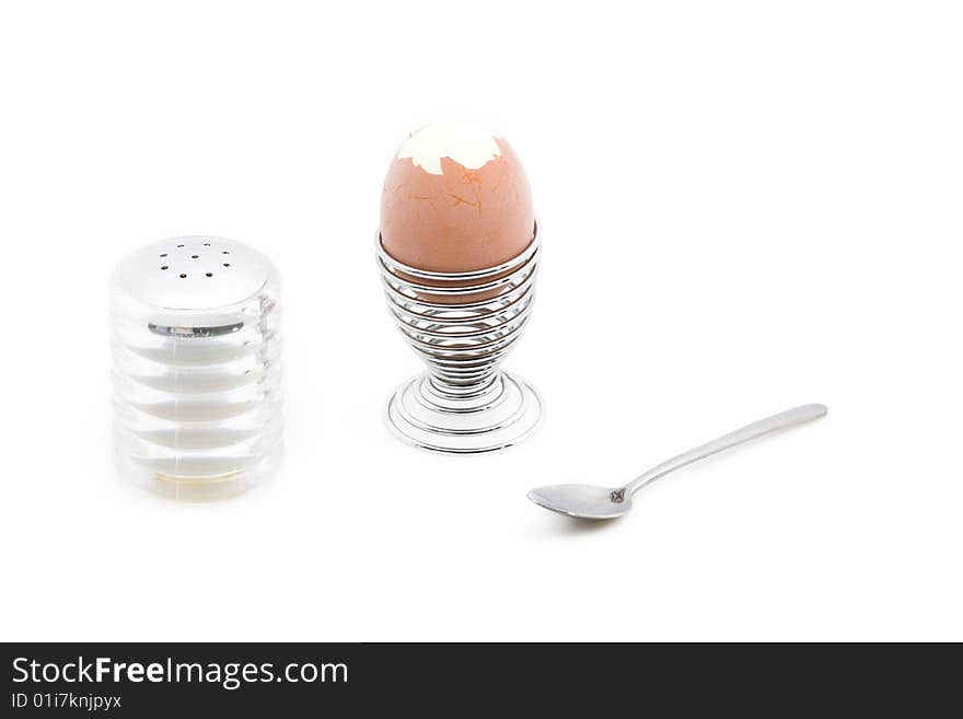 An eggcup with a pealed egg