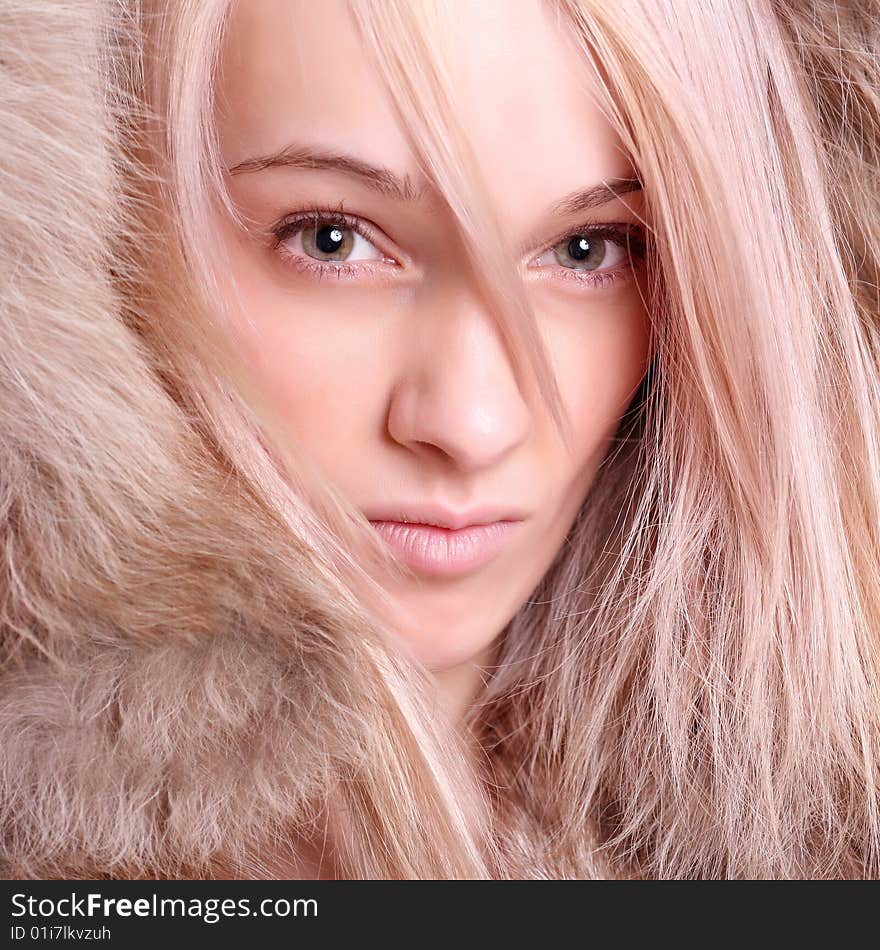 Portrait of the beautiful girl with magnificent fur