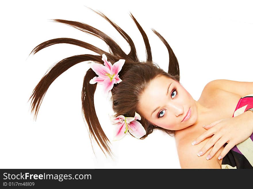 Beautiful young woman with flowers in her hair. Beautiful young woman with flowers in her hair