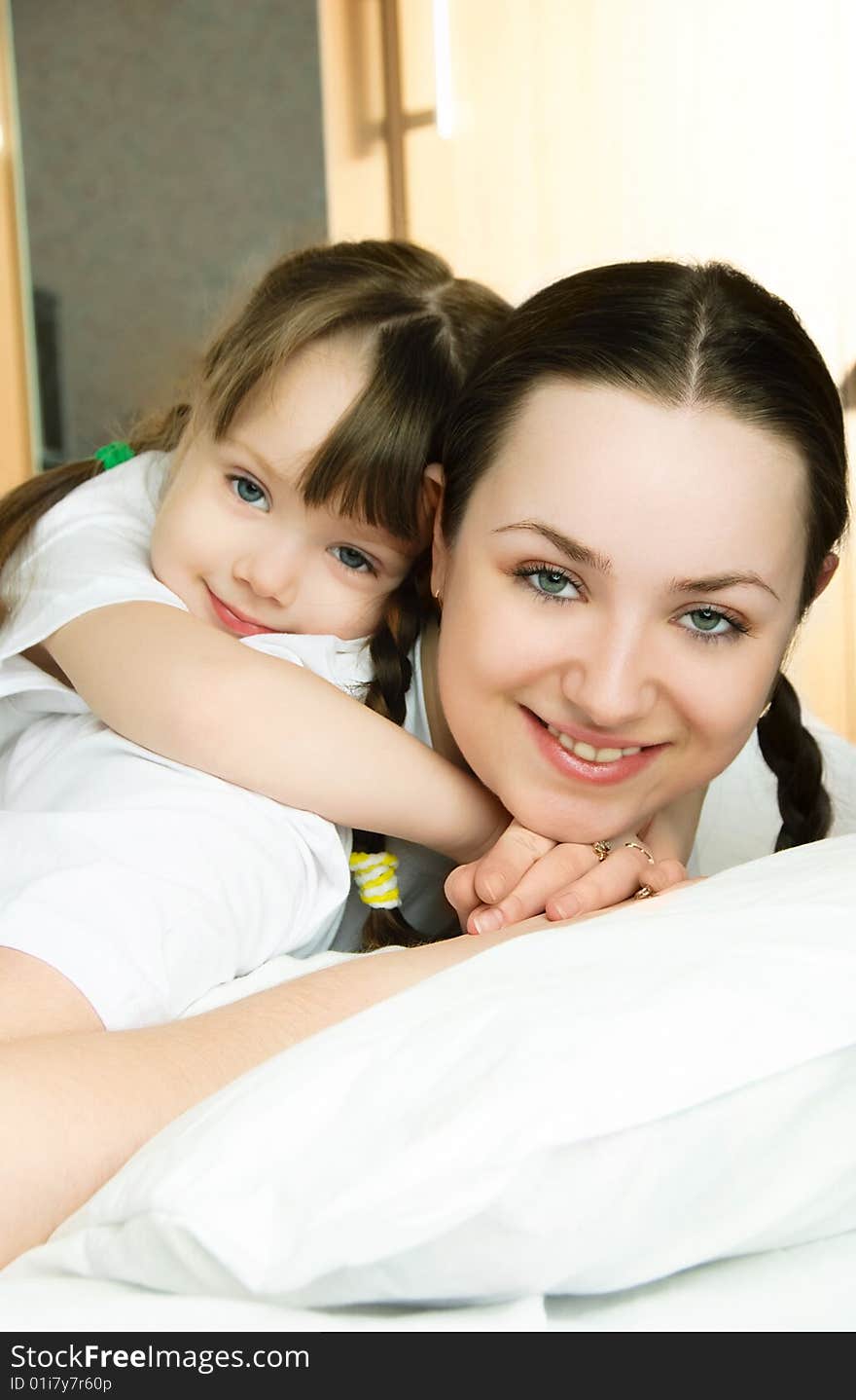 Mother and daughter on the bed