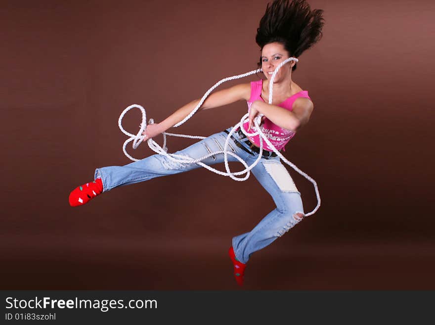 The young beautiful girl during active leisure on a white background