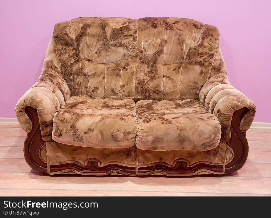 Brown soft sofa on purple background