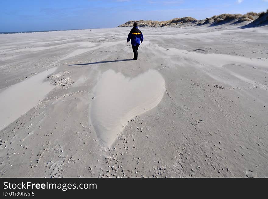 Sandy heart formed by wind on a beach. Sandy heart formed by wind on a beach