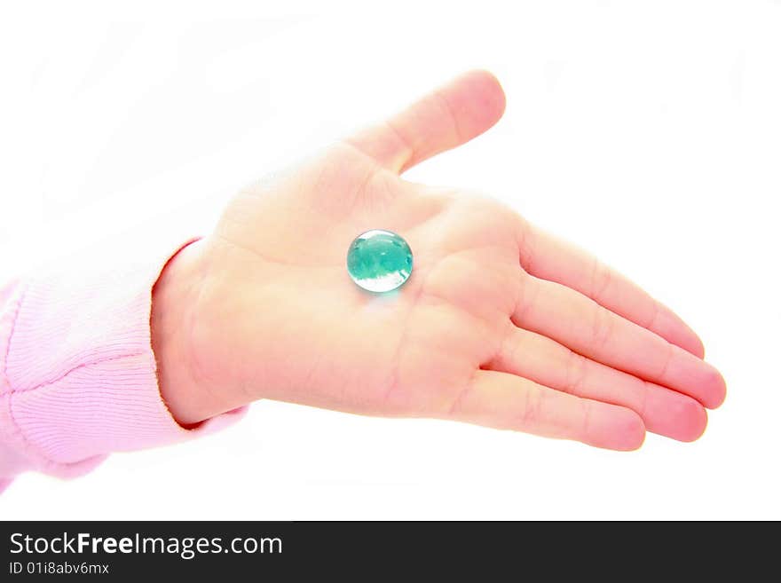 Child holding blue stone in hand