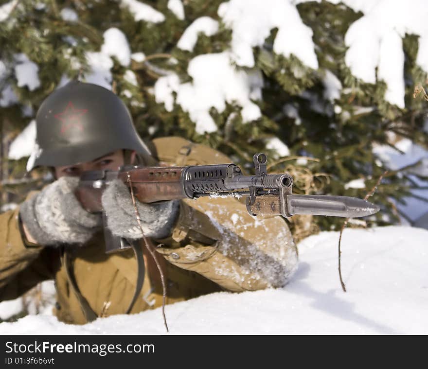 Red Army soldier aims from a rifle