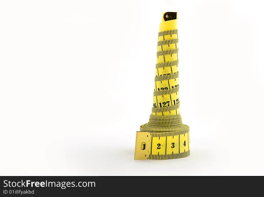 Yellow tape measure in tower shape