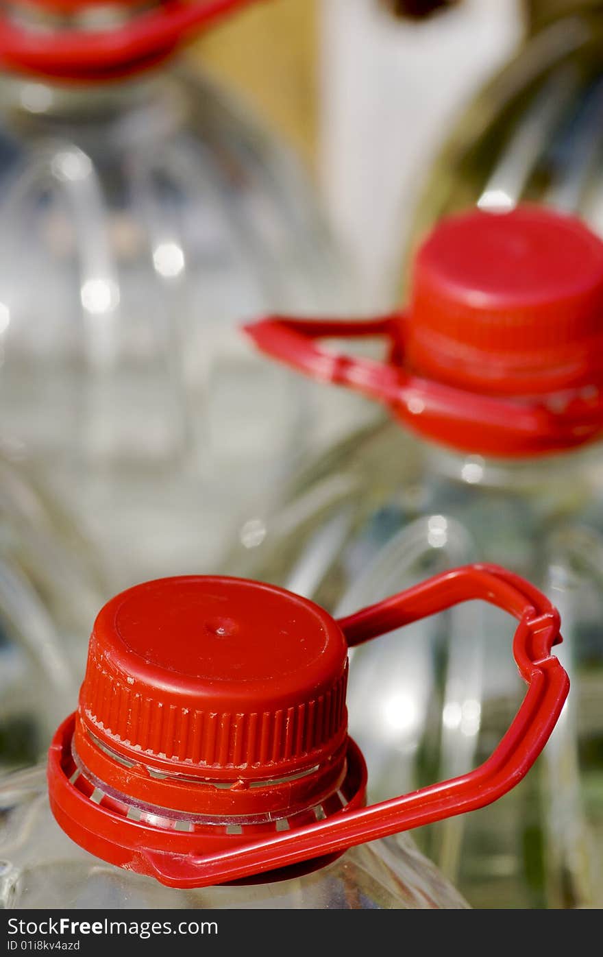 Large bottle of water with red cap. Large bottle of water with red cap