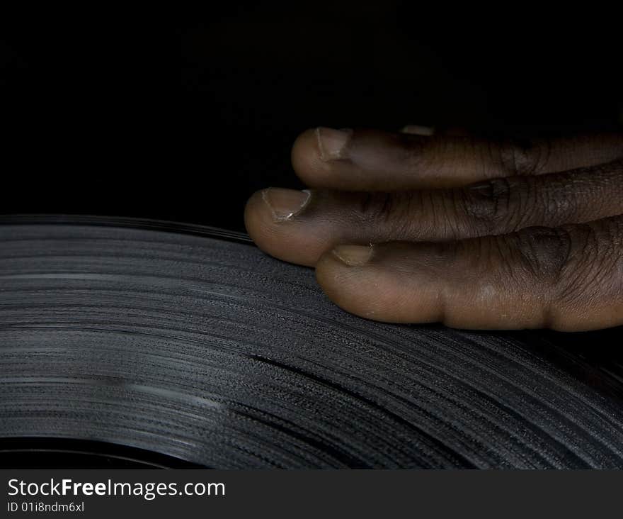 Close up of a hand on the lp. Close up of a hand on the lp