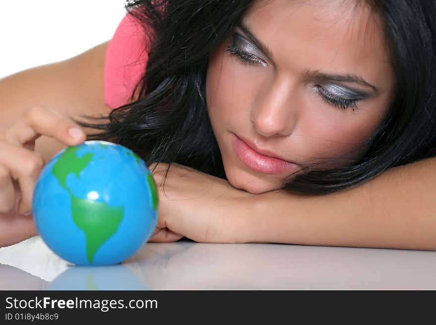 Beautiful girl and small globes, isolated on a white background. Beautiful girl and small globes, isolated on a white background