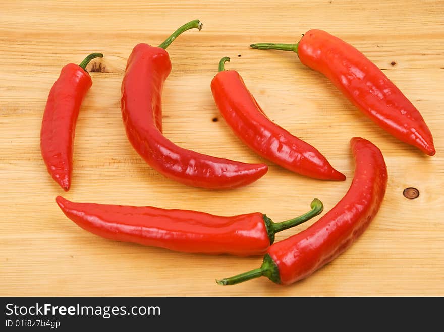 Fresh red  peppers on a wood table textured,check also <a href=http://www.dreamstime.com/healthy-food-rcollection8217-resi828293>Healthy food</a>