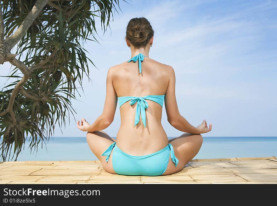 Portrait of young woman practicing yoga in summer environment. Portrait of young woman practicing yoga in summer environment