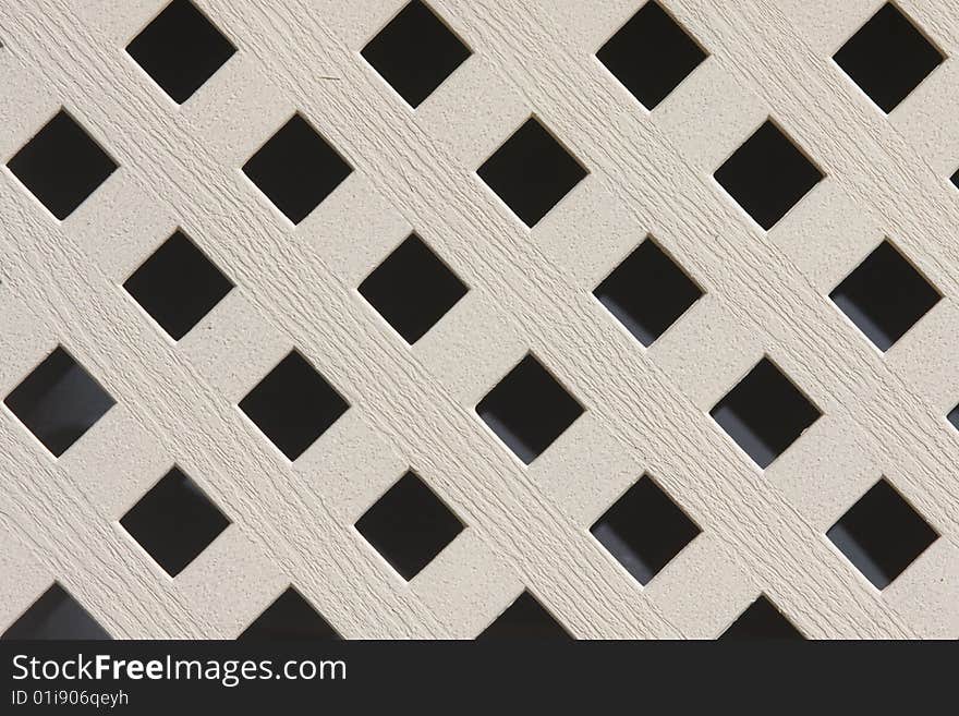 A checkered patter from a close-up of lawn furniture. A checkered patter from a close-up of lawn furniture