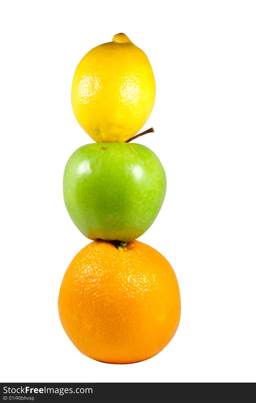 A lemon on an apple on an orange. A lemon on an apple on an orange