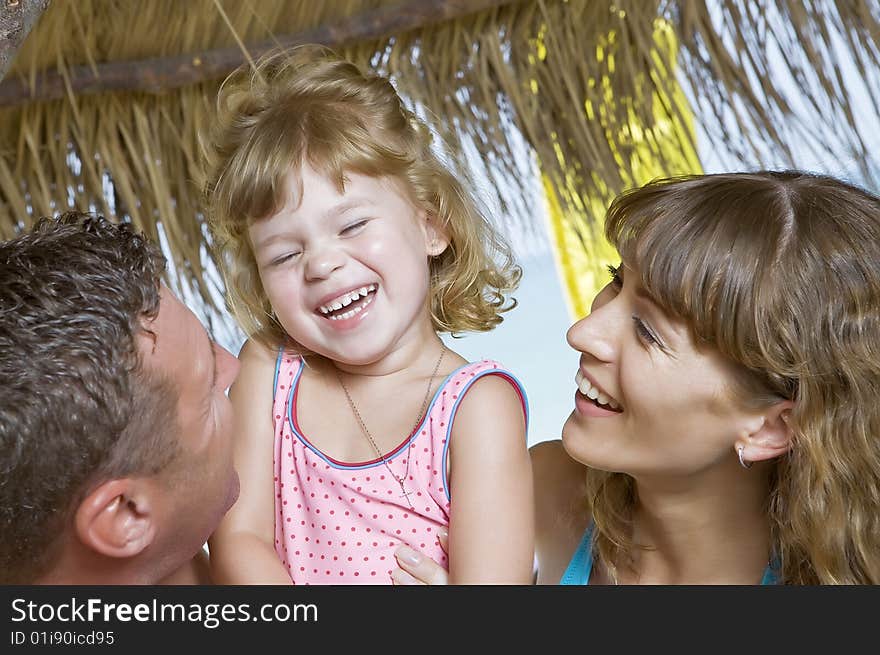 High key portrait of nice young family getting busy