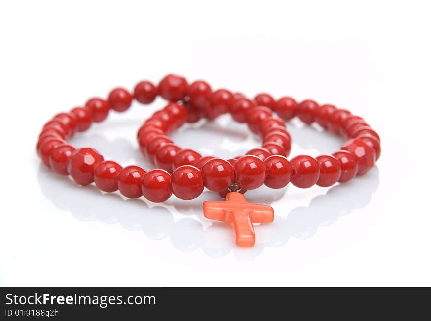 Red coral necklace, white background