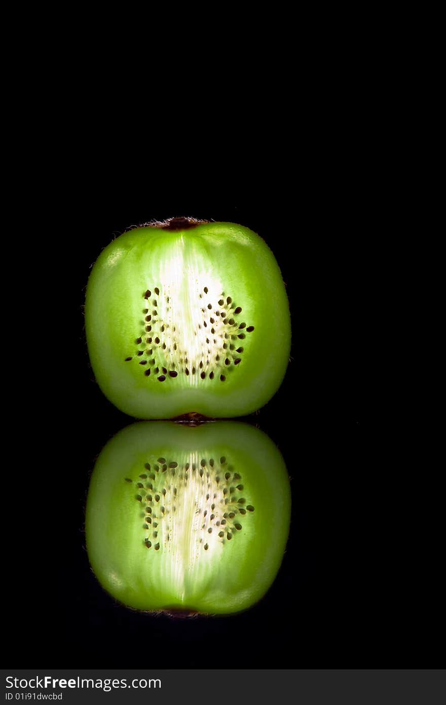 View of fresh kiwi slice on black back