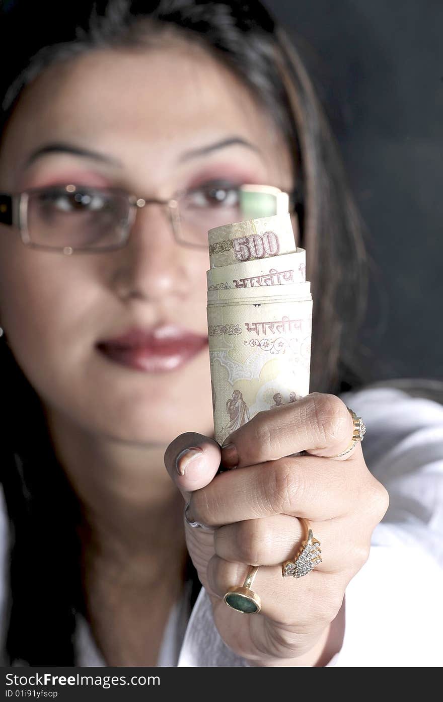 Girl showing money in studio. Girl showing money in studio.