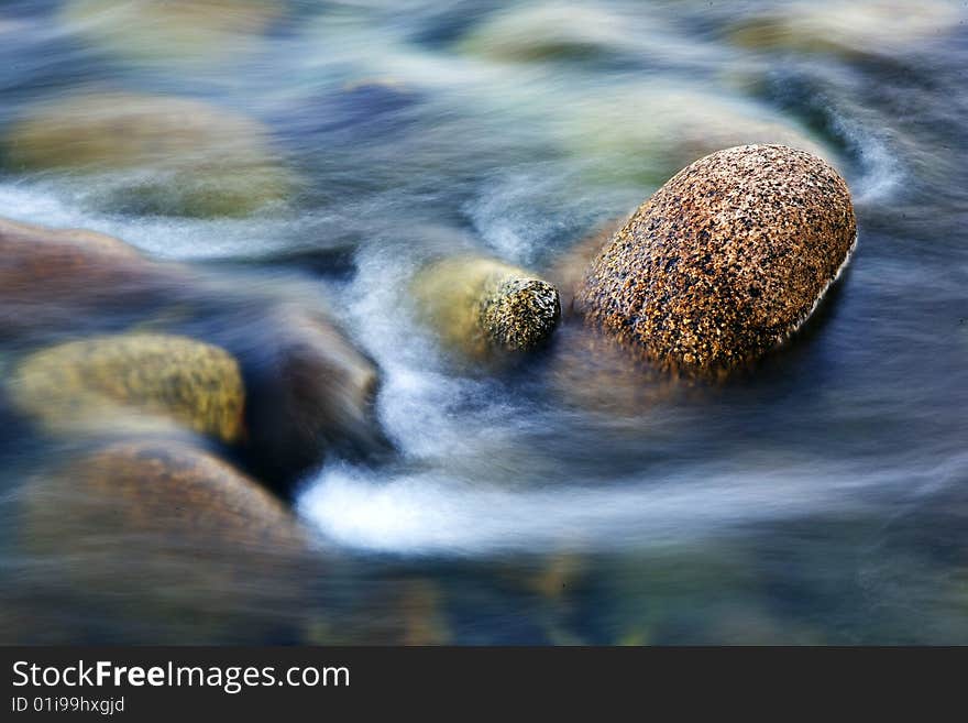 River with calm water and stone. River with calm water and stone