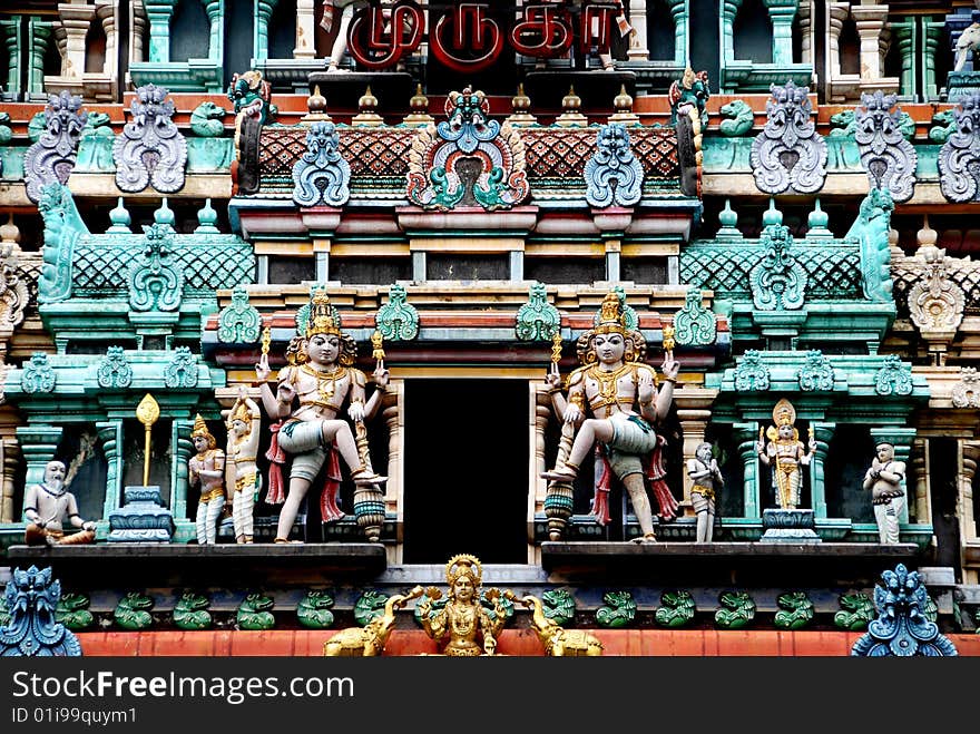 A wealth of finely carved figures cover the ornate Sikhara entrance tower to the 1859-1983 Thendayuthapani Hindu Temple on Tank Road in Singapore - Lee Snider Photo. A wealth of finely carved figures cover the ornate Sikhara entrance tower to the 1859-1983 Thendayuthapani Hindu Temple on Tank Road in Singapore - Lee Snider Photo.