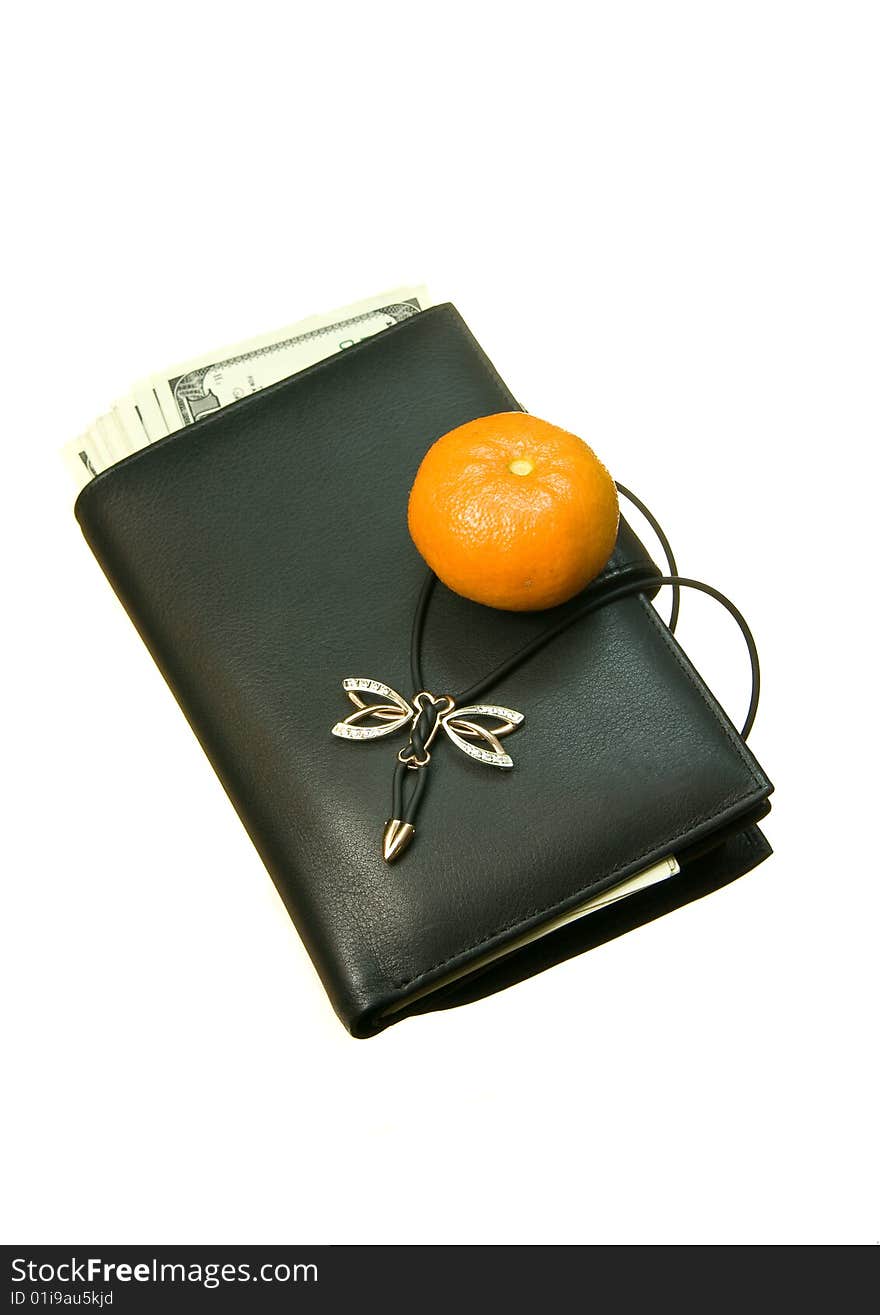 Leather wallet cash for women, with some barely visible banknotes inside, close-up isolated on white background, with mandarine on it. Leather wallet cash for women, with some barely visible banknotes inside, close-up isolated on white background, with mandarine on it.