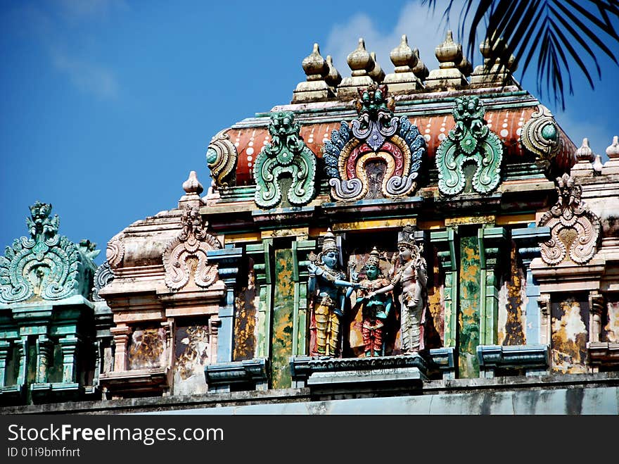 Colourful and ornate figures crown the bulbous Sikhara tower roof finial at the 1859-1983 Sri Thendayuthapani Hindu Temple on Tank Road in Singapore - Lee Snider Photo. Colourful and ornate figures crown the bulbous Sikhara tower roof finial at the 1859-1983 Sri Thendayuthapani Hindu Temple on Tank Road in Singapore - Lee Snider Photo.