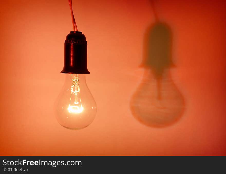 Photo of light bulb on red background