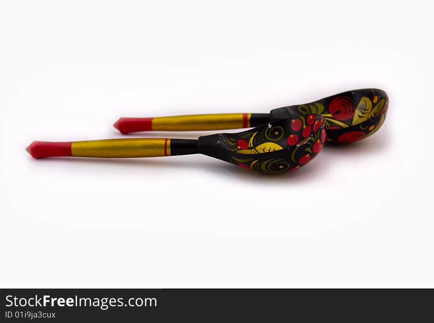 Two wooden spoons isolated on a white background.