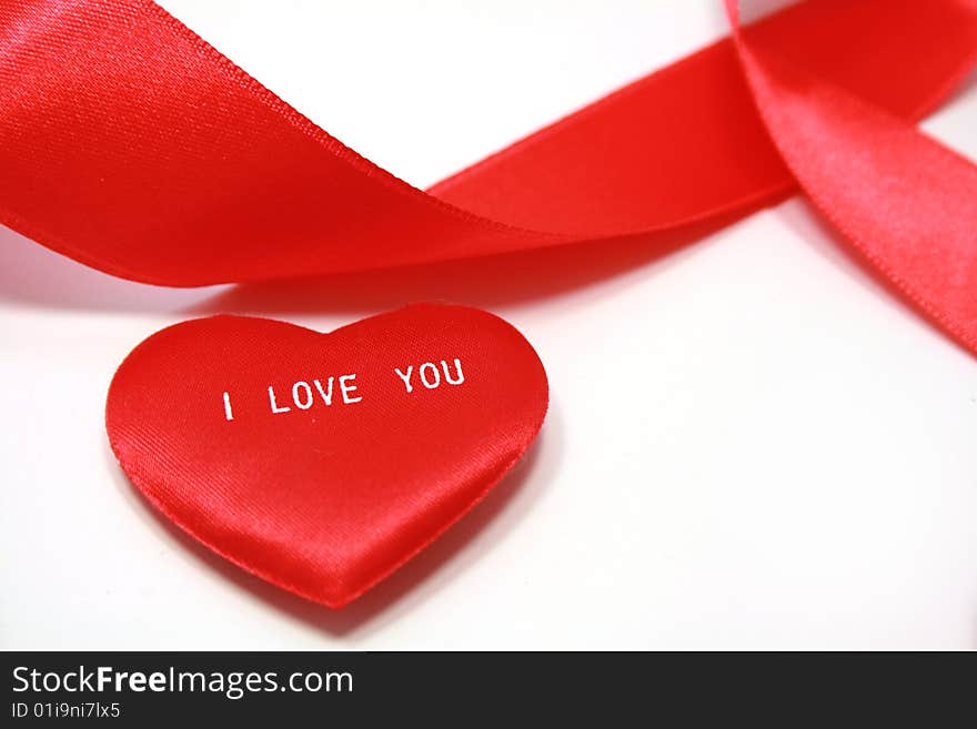 Read heart and red ribbon on white it is isolated. Read heart and red ribbon on white it is isolated