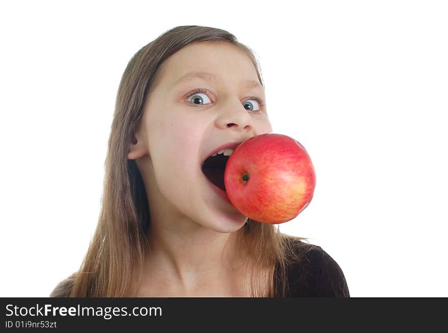 The cute little girl eating the apple. The cute little girl eating the apple