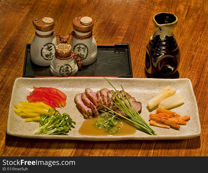 Delicious Japanese dish stalled on a table in a Japanese restaurant. Delicious Japanese dish stalled on a table in a Japanese restaurant