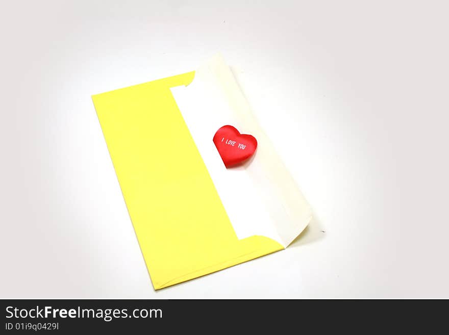 Yellow paper envelope with white red heart. Yellow paper envelope with white red heart