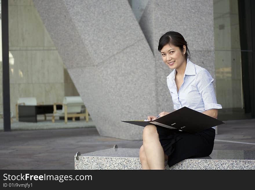 Happy Business Woman Writing Some Notes