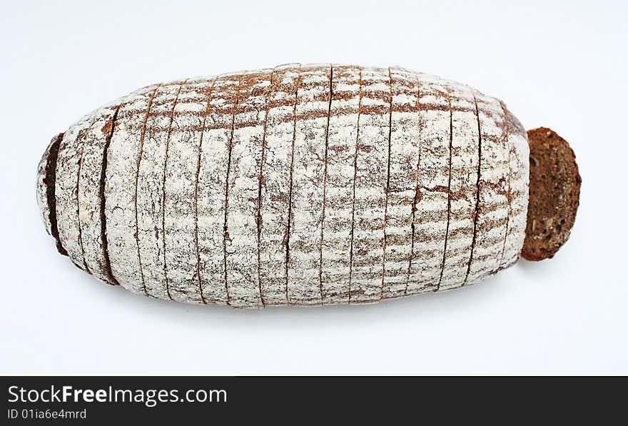 Sliced loaf of cereal bread on white background