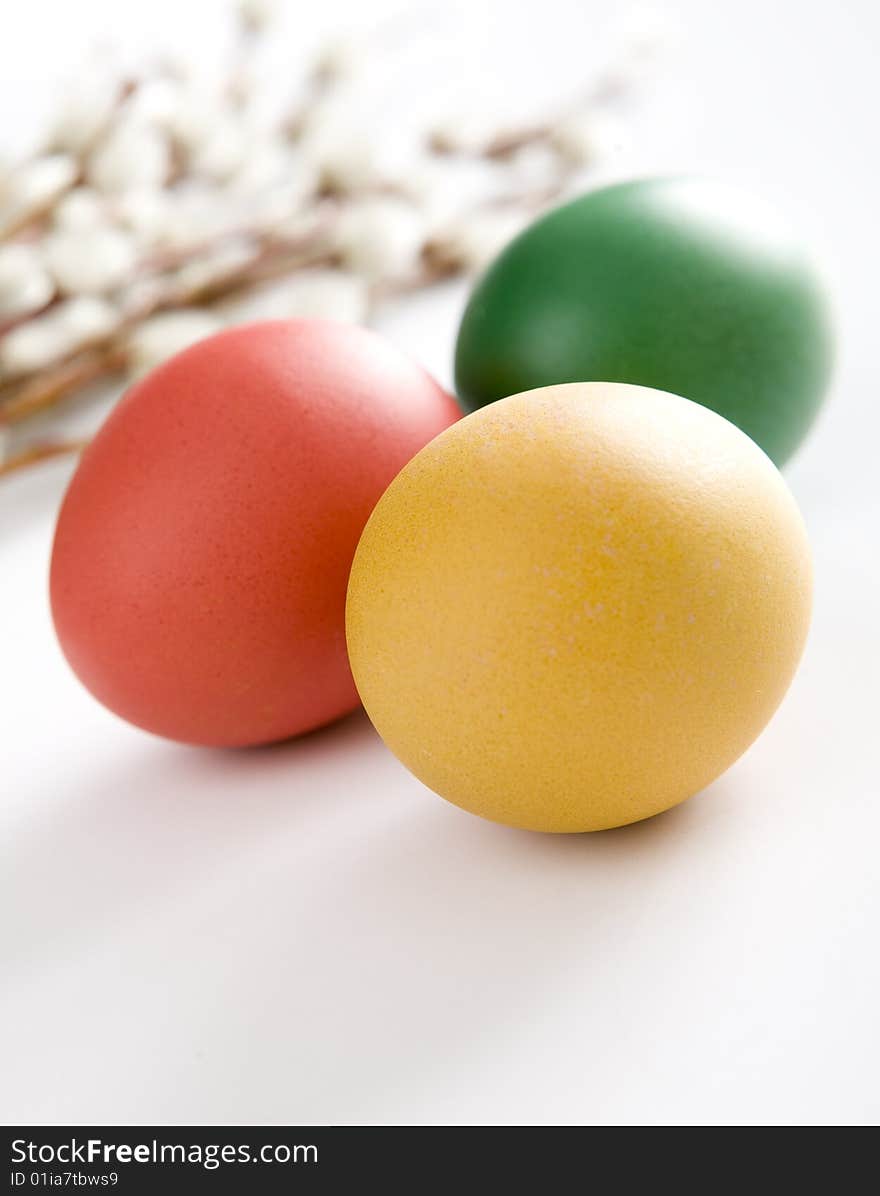 Colorful easter eggs and yellow tulips