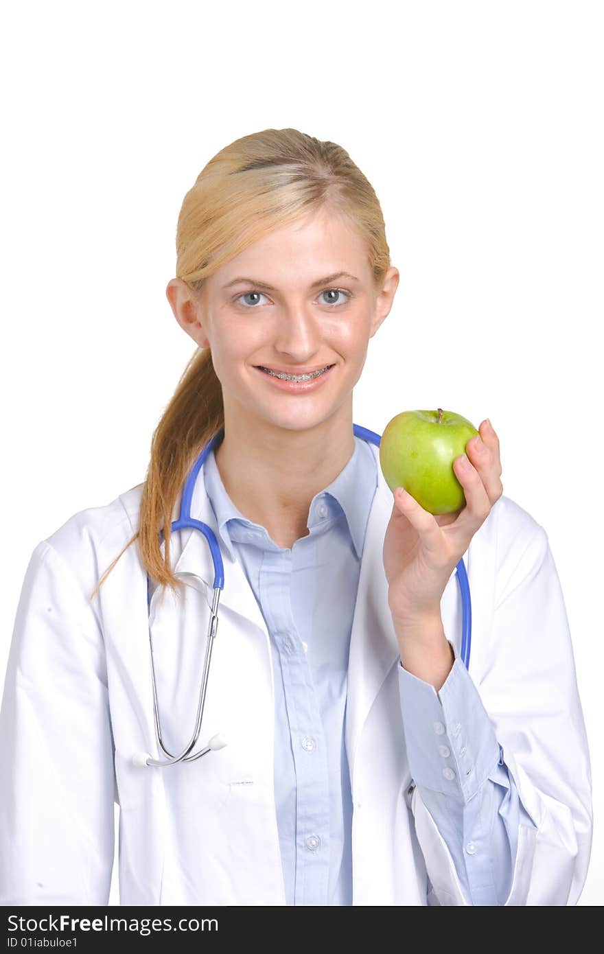 Woman doctor holding an apple isolated on white