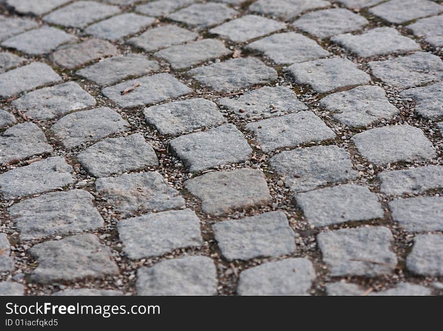 A circular cobbled pathway close up