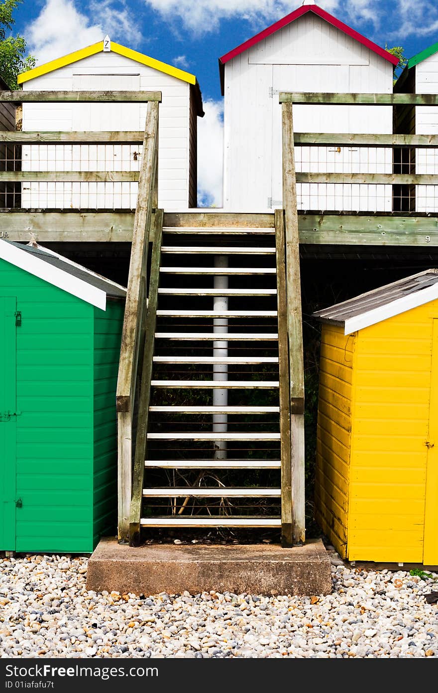 A group of colorful seaside beach huts