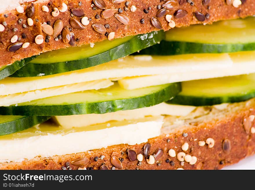 Macro of cheese and cucumber sandwich wholegrain bread. Macro of cheese and cucumber sandwich wholegrain bread