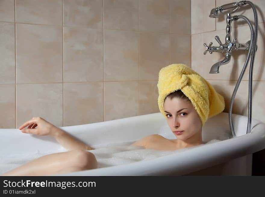 Young beautiful woman in the retro bathroom