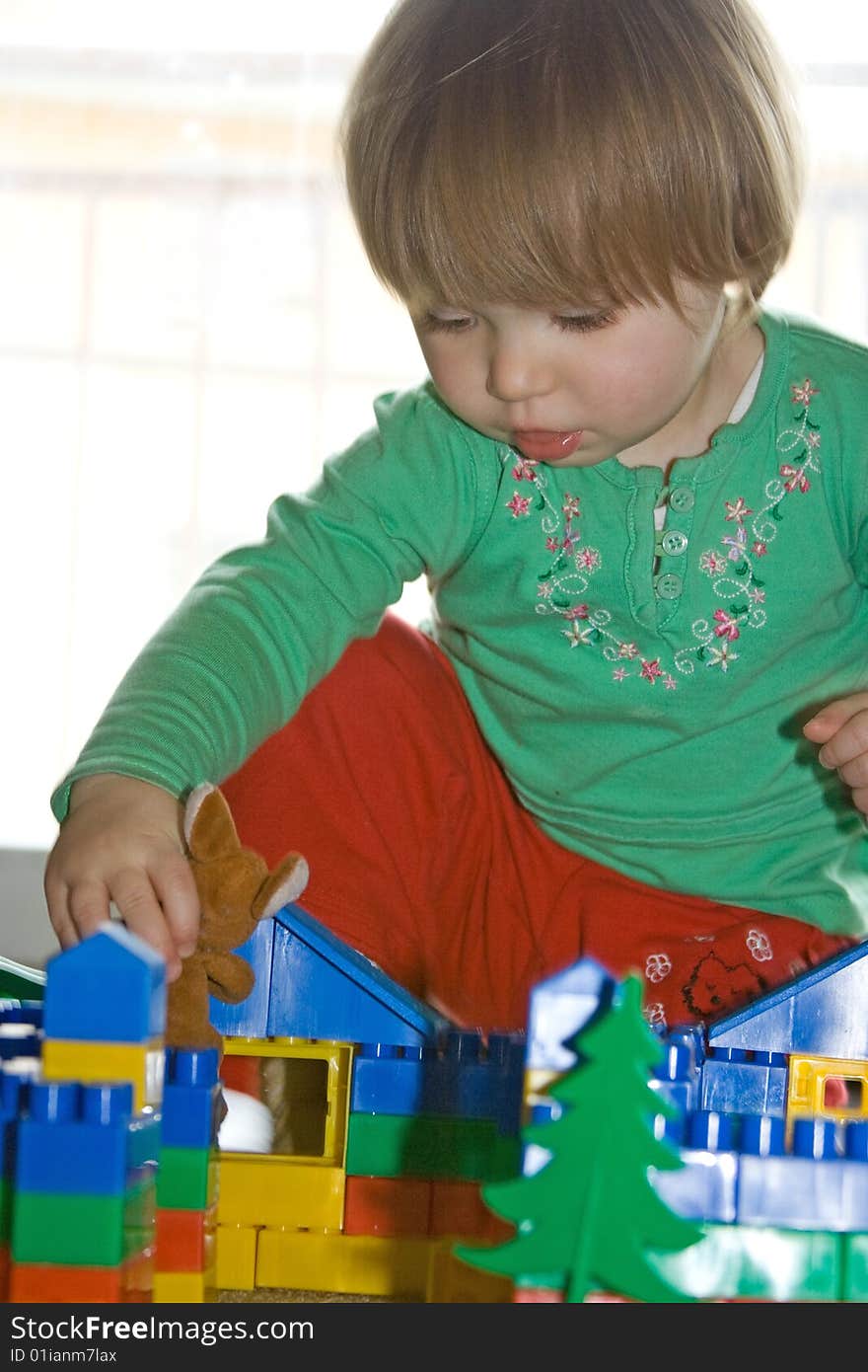 Sweet toddler baby girl playing at home. Sweet toddler baby girl playing at home