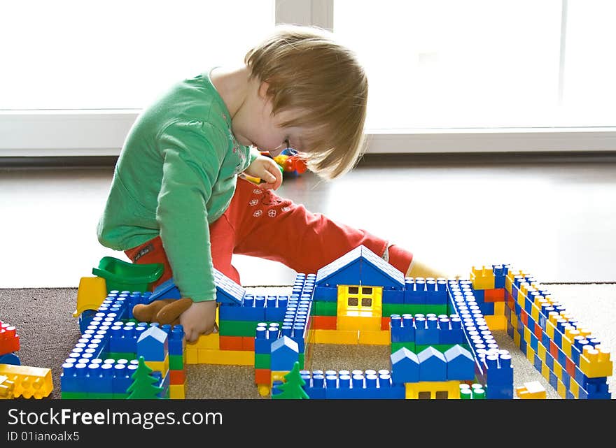 Sweet toddler baby girl playing at home. Sweet toddler baby girl playing at home