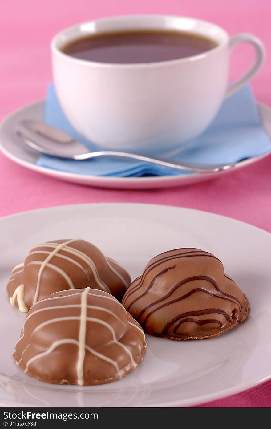 Tea and biscuits on a pink background. Tea and biscuits on a pink background