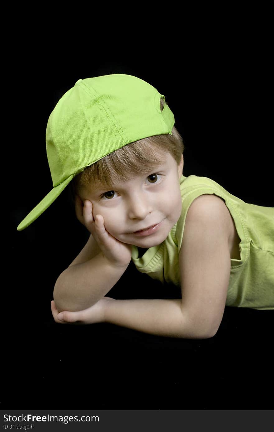 A portrait of a cute three year old boy wearing a hat andmatching top. A portrait of a cute three year old boy wearing a hat andmatching top.