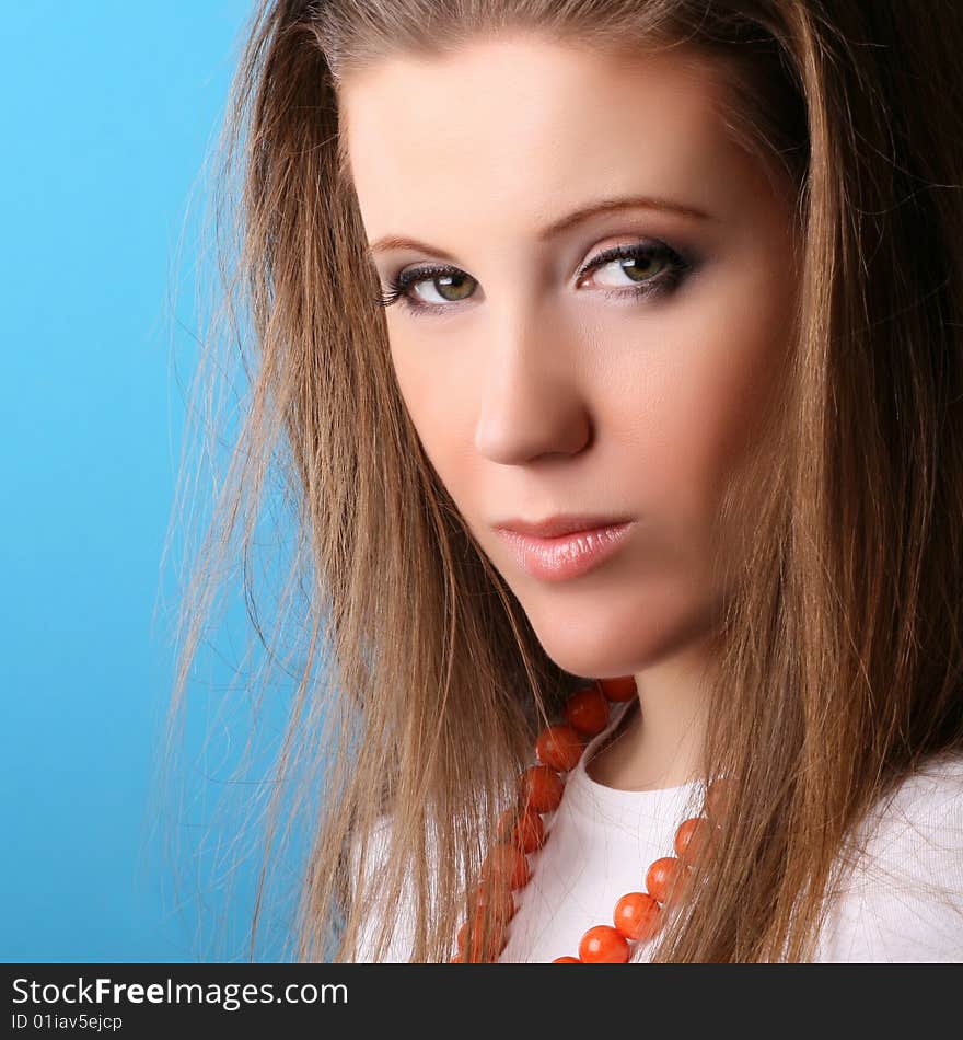 Young positive woman isolated on blue background. Young positive woman isolated on blue background