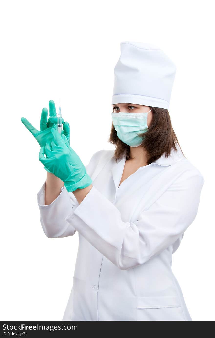 Young doctor prepares for injection over white background