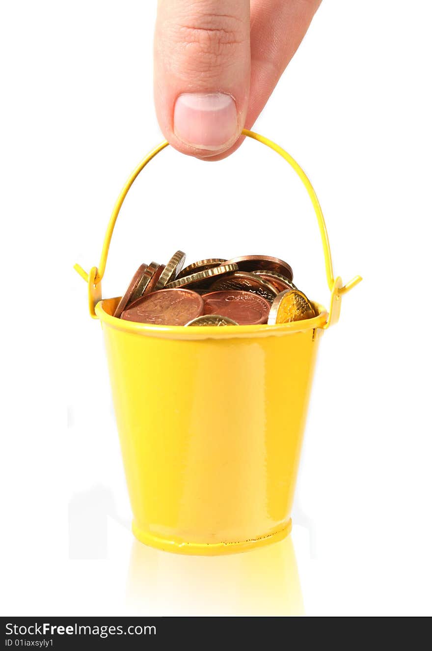 Bucket full of coins isolated on white background. Bucket full of coins isolated on white background.