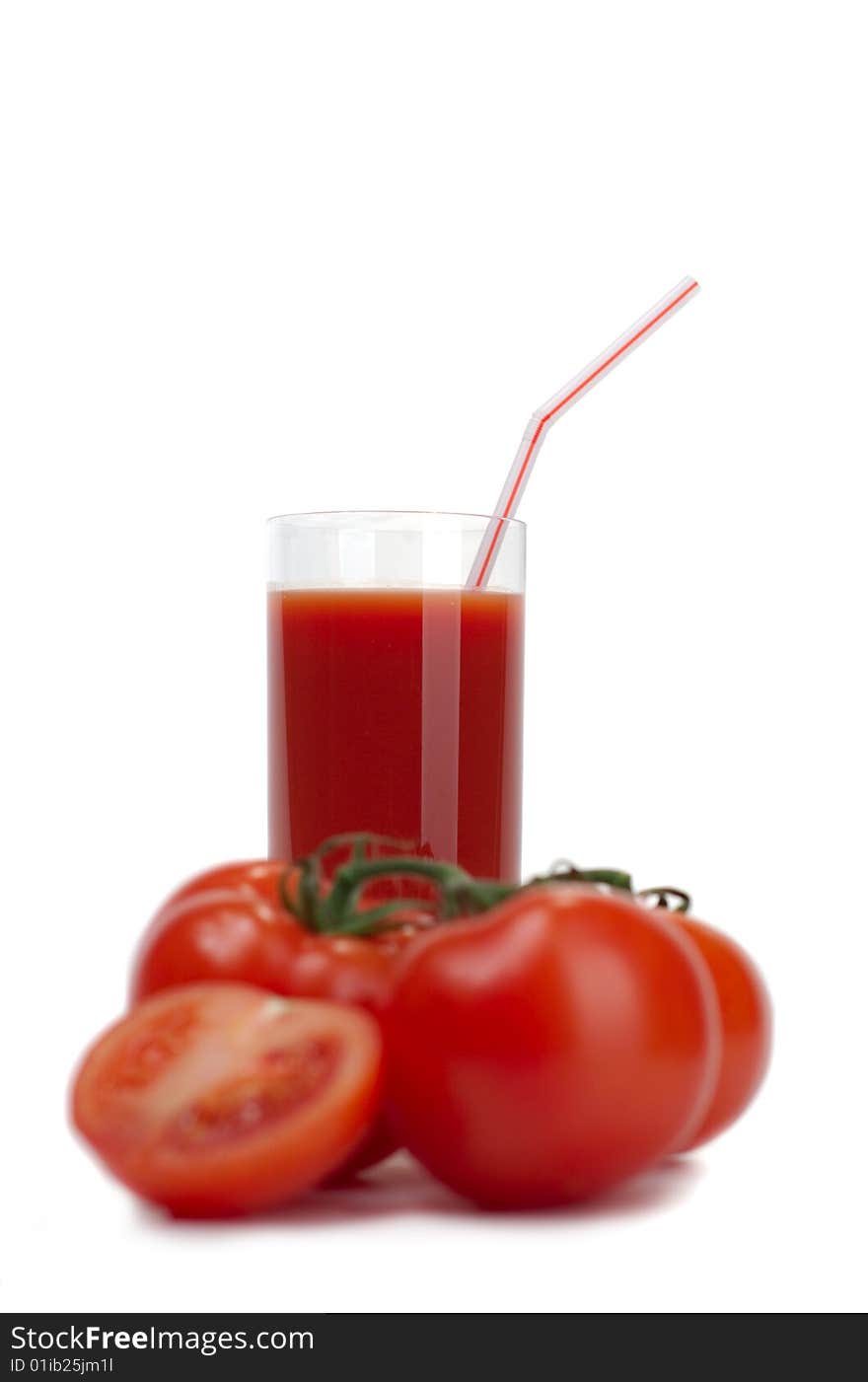 Fresh juicy tomatoes and tomato juice on a white background